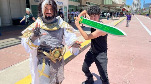 Carlos Vera Vandal, dressed as Doctor Strange from the video game "Marcel Rivals," poses with a friend outside San Diego Comic-Con on Preview Night, July 23, 2025.