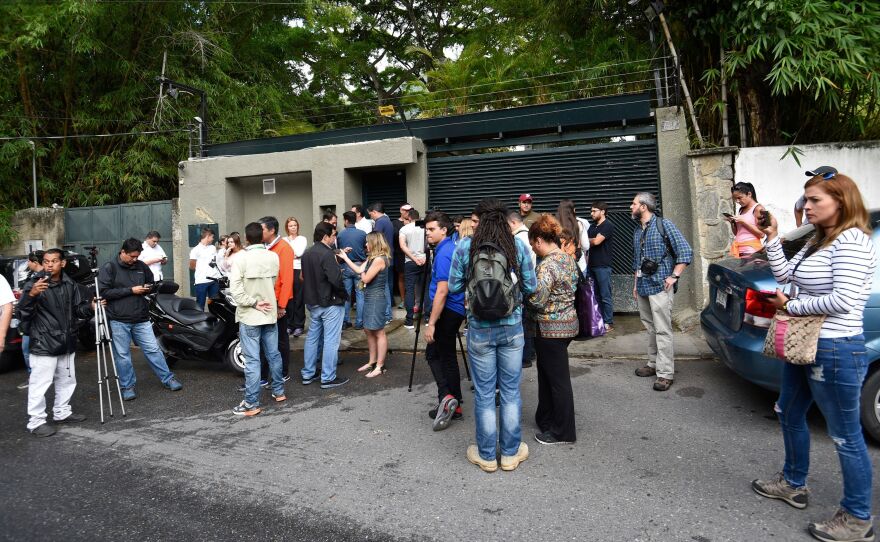 After Venezuelan opposition leader Leopoldo López was released from prison and placed under house arrest, his supporters and the media gathered outside his house in Caracas Saturday.