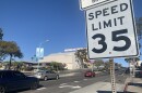 Cars drive past a 35 mph speed limit sign on El Cajon Boulevard, March 8, 2022.