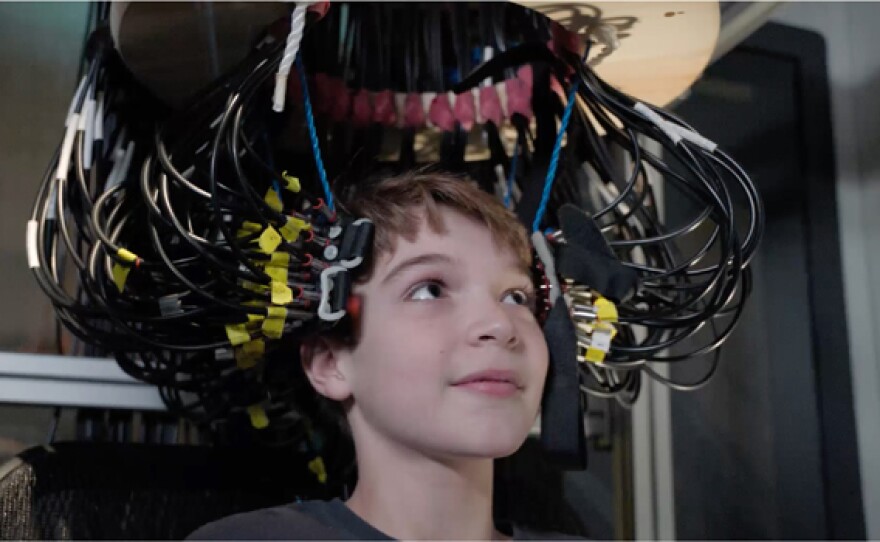 11-year-old "super memory" kid Jake Hausler in DOT scanner at Washington University.