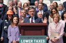 Speaker of the House Mike Johnson, R-La., and fellow Republicans celebrate GOP tax policies at an event outside the Capitol in Washington, Wednesday, April 15, 2026.