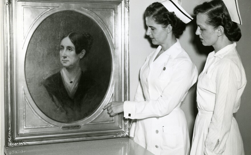 St. Elizabeths nurses in the 1950s study a portrait of Dorothea Lynde Dix, a 19th century social reformer. Dix helped found the treatment facility in the 1850s.