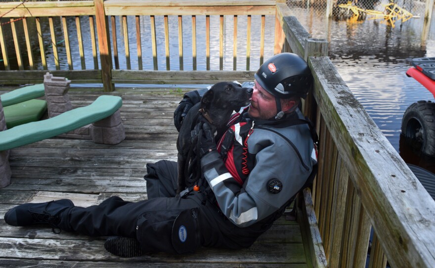 Leath has become known among fellow rescuers as the "dog whisperer" because of his skill at comforting frightened canines.