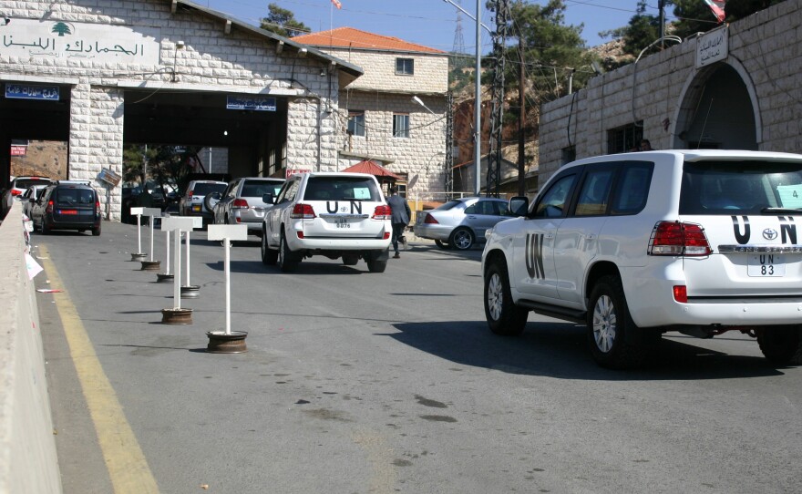 A convoy of United Nations vehicles at the Lebanon-Syria Masnaa border crossing on Oct. 1 as a chemical weapons disarmament team awaited entry into Syria.