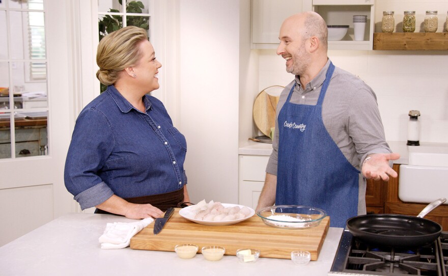 Bryan Roof (right) visits San Diego, Calif. and shares his version of San Diego Fish Tacos with host Julia Collin Davison (left).