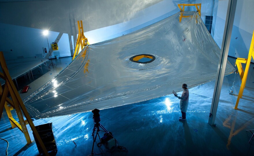 A high-tech, five-layer sunshield helps the telescope stay at negative 370 degrees Fahrenheit, so it can detect heat signals from very distant objects.