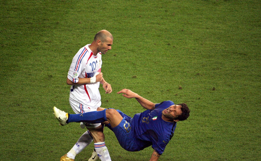 A photo taken July 9, 2006 of French midfielder Zinedine Zidane (L) gesturing after head butting Italian defender Marco Materazzi during the World Cup 2006 final football match between Italy and France at Berlin's Olympic Stadium.