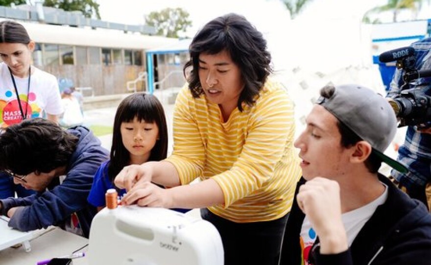 Rizzhel Javier is pictured in an undated photo teaching fiber arts and sewing to youth.