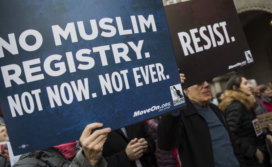 Demonstrators march from the Department of Justice to the White House in December 2016 to protest the National Security Entry-Exit Registration System program and then-President-elect Donald Trump's plan to restrict travelers from Muslim countries