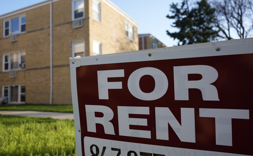 A "For Rent" sign displays outside an apartment building in Skokie, Ill., in 2024.  Researchers from the Urban Institute found that a growing number of renters in the U.S. are struggling to pay for housing each month.