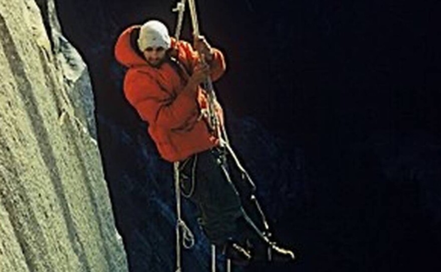 This photo by climbing partner Wayne Merry and provided by the Whitmore Family Trust shows George Whitmore dangling off an outcropping during the historic first ascent of El Capitan in Yosemite National Park in 1958.