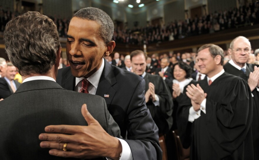 President Barack Obama walks down the center aisle before delivering last year's State of the Union address in Congress.