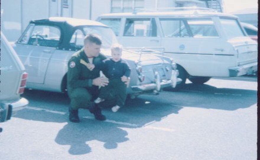 Marine Capt. Jerry Zimmer holds his son, Craig.