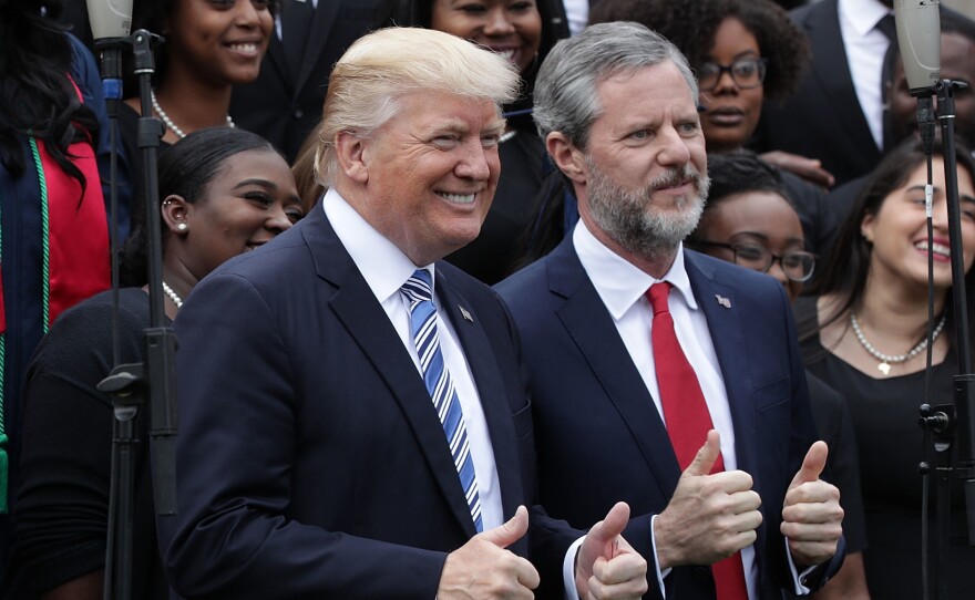 President Trump poses with Liberty University President Jerry Falwell Jr., during commencement at Liberty University May 13 in Lynchburg, Va.