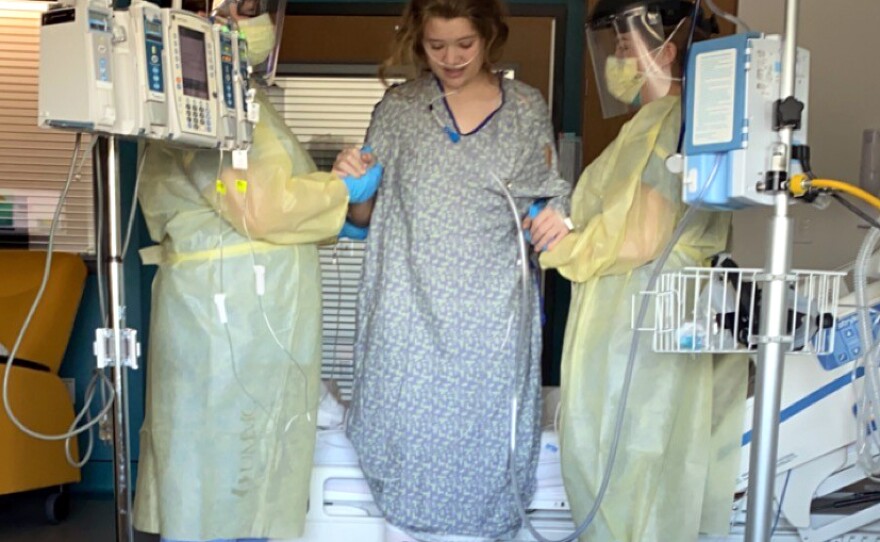 Allie takes a walk during her hospitalization in January, with the help of physical and occupational therapists. Even after she was able to return to school, recovery was slow. She was overcome by seizures sometimes and passed out at least twice. One night, Allie awoke and couldn't feel her legs.