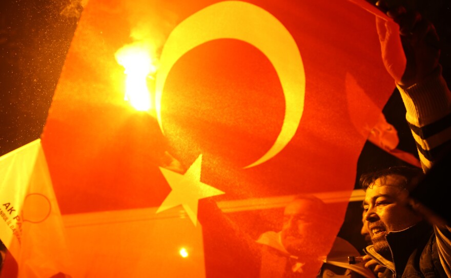 Supporters of Turkey's President Recep Tayyip Erdogan and the Justice and Development Party (AKP) celebrate a decisive win in parliamentary elections Sunday.