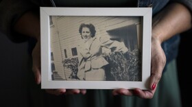 Stacy Cordova, whose aunt was a victim of California's forced sterilization program that began in 1909, holds a framed photo of her aunt Mary Franco, Monday, July 5, 2021, in Azusa, Calif.
