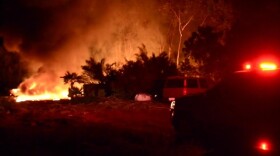 A brush fire destroyed two vehicles and burned vegetation in the 2100 block of Esplendido Avenue in San Marcos, April 18, 2016.