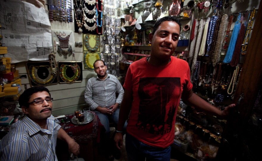 Scenes from the Khan el-Khalili market in downtown Cairo. Karim Gomma (right), a shop worker, says he's voting for the Muslim Brotherhood candidate, Mohammed Mursi. But he says most shop owners are voting for Ahmed Shafiq because he has promised to restore law and order.
