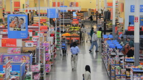 Groceries sit on shelves next to a variety of other goods at a Walmart in Fairfax County, Va. Analysts say Walmart's announcement Thursday on healthy foods may attract customers who buy not only groceries, but other higher-margin goods.
