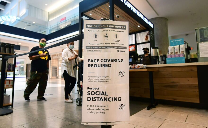 Social distancing instructions are posted at California's Westfield Santa Anita shopping mall on June 12, as local businesses enter Phase 3 reopening.