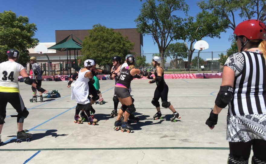 A roller derby scrimmage in Albuquerque, N.M. Three of the women participating — Lauren Winkler, Leigh Featherstone and Holly Chamberlin — have kept their support of Hillary Clinton quiet.