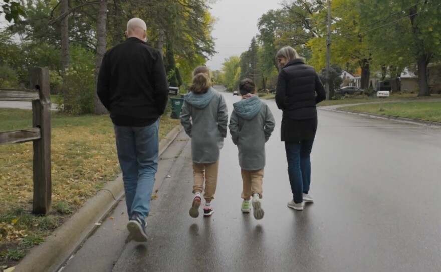 Alight sponsors based in Minneapolis take a walk with two sisters from Ukraine who moved to the U.S. with their family.