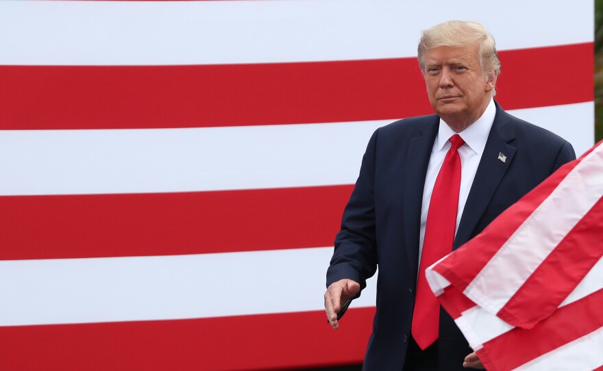President Trump arrives to talk about the environment during a Tuesday stop in Jupiter, Fla.