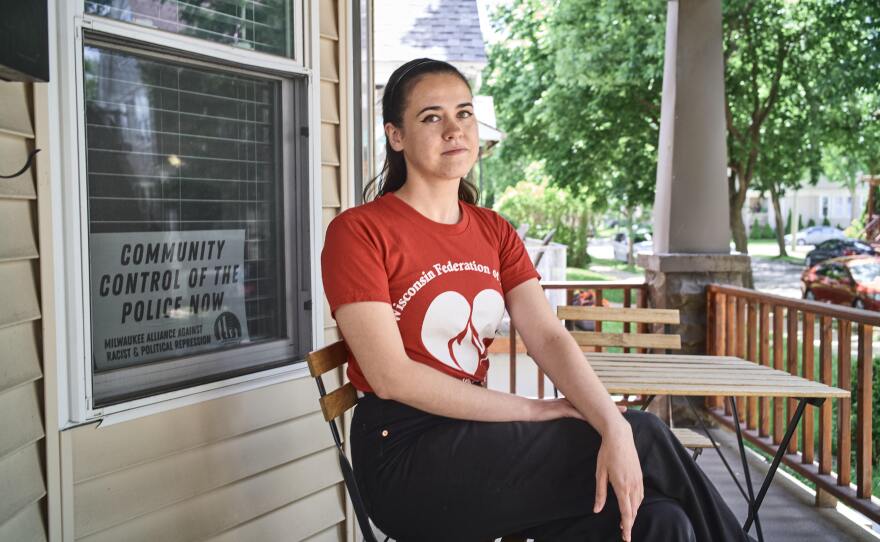 Kellie Lutz, a former barista at Stone Creek Coffee who led the union campaign there in 2019, sits on the porch of her home in Milwaukee. Lutz is now a certified nursing assistant and a shop steward in a health care union.