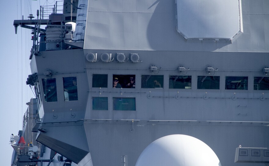 Two American Naval officers observe flight operations from the bridge of the JS Kaga off the coast of San Diego, Calif. Nov. 6, 2024.