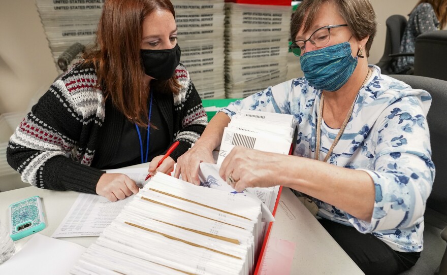 Lehigh County workers count ballots as vote counting in the general election continues on Thursday in Allentown, Pa.