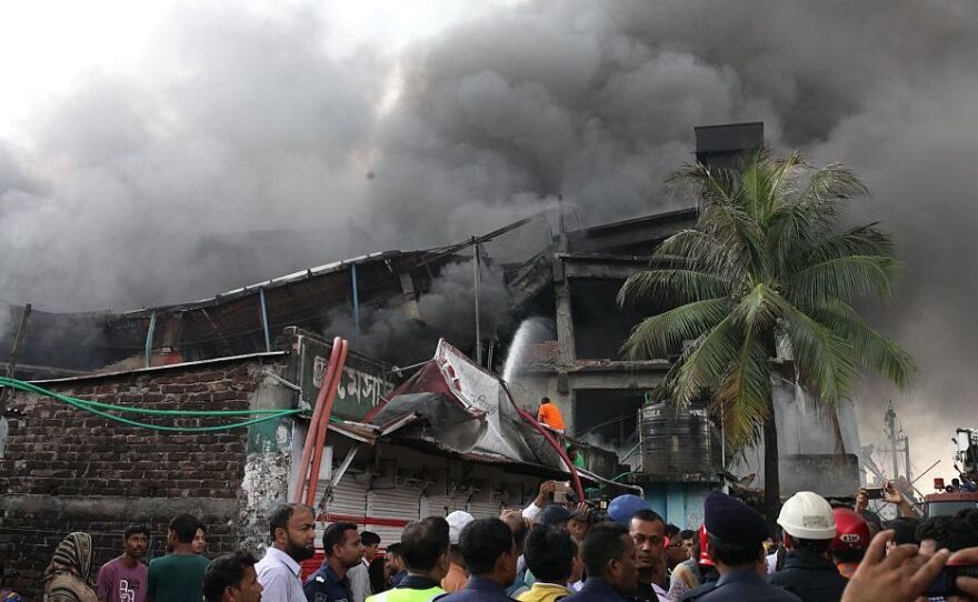 Firefighters try to extinguish the fire at a packaging factory in the industrial zone of Tongi on Saturday.
