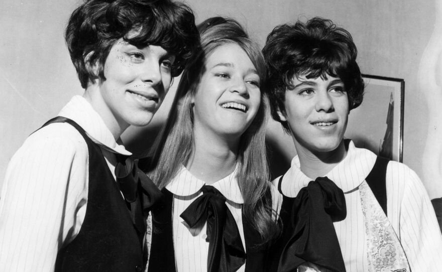 Three members of the Shangri-Las are seen on a visit to London in 1964, with Mary Weiss pictured in between twins Marge and Mary Anne Ganser.