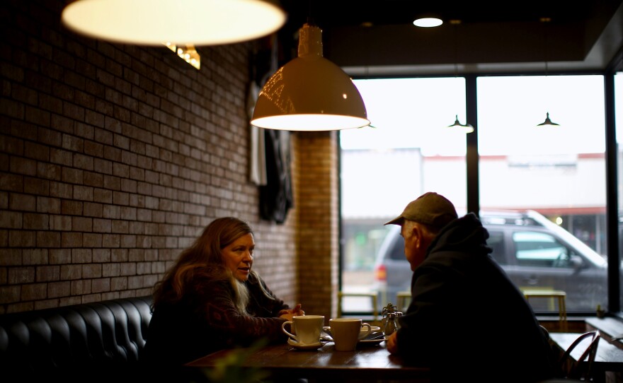 Customers enjoy a conversation while dining at one of Sidney's main street restaurants, which serves coffee in the morning and craft beers at night.