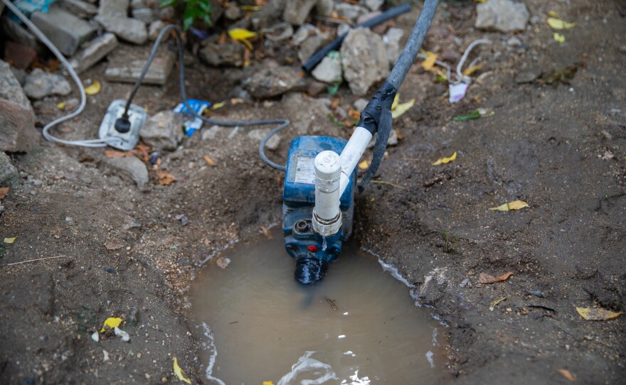 An electric motor pump is essential to push water from the utility's pipes to private homes in La Paz. A community leader says residents began using pumps for this purpose some 30 years ago.