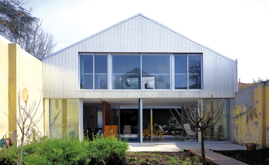 <a href="https://www.lacatonvassal.com/index.php?idp=15">This house in Bordeaux</a> was built in a former biscuit factory in 1999. Part of the roof has been removed to allow natural light into an intramural garden.