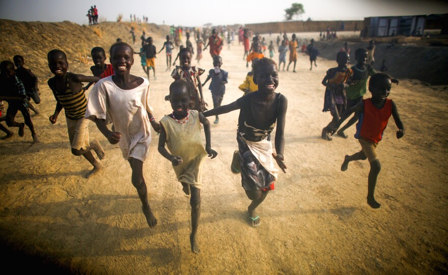 Kids find a moment of joy at the U.N. camp near the ruined town of Bentiu.