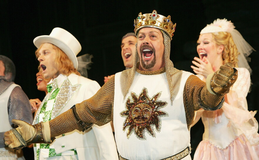 Tim Curry sings during the opening night curtain call for Monty Python's Spamalot in March 2005 in New York City.