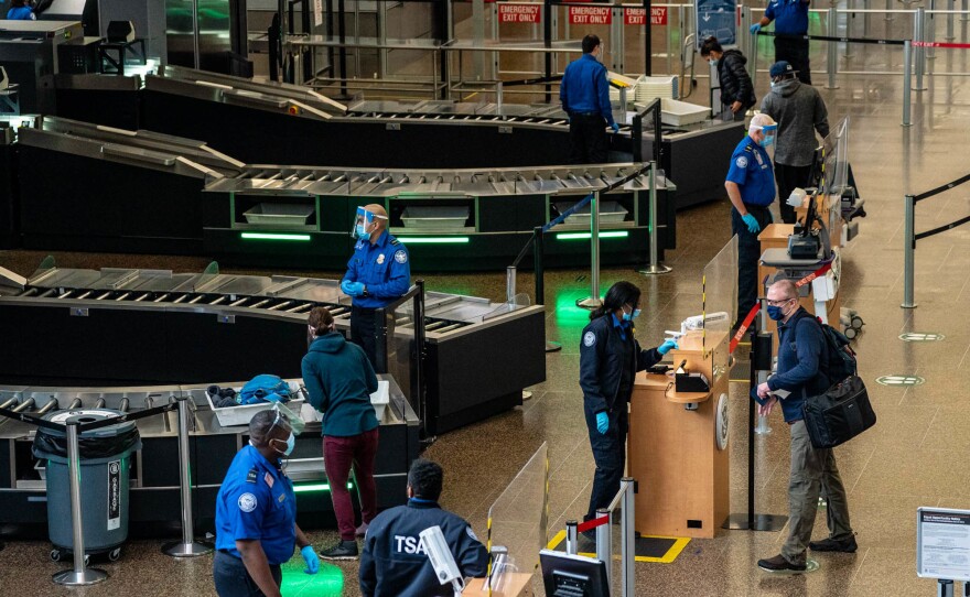 Travelers pass through security screening at Seattle-Tacoma International Airport on Nov. 29, 2020.