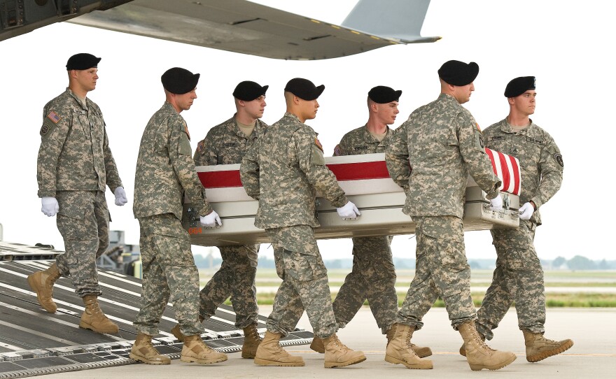 A U.S. Army carry team transfers the remains of Capt. Bruce A. MacFarlane