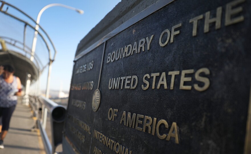 A plaque marks the U.S. border on the Paso Del Norte Port of Entry bridge which connects the U.S. and Mexico on July 23, 2018. As many as 2,551 migrant children ages 5 to 17 were separated from their families after they crossed into the U.S. from Mexico along the border.