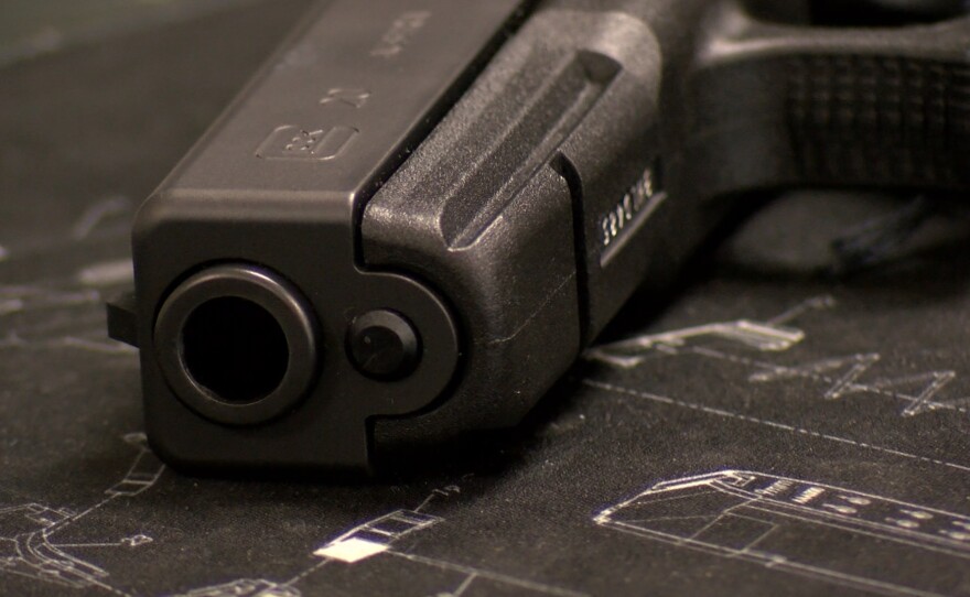 A handgun sits on a table inside a San Diego County gun shop, Sept. 5, 2018.