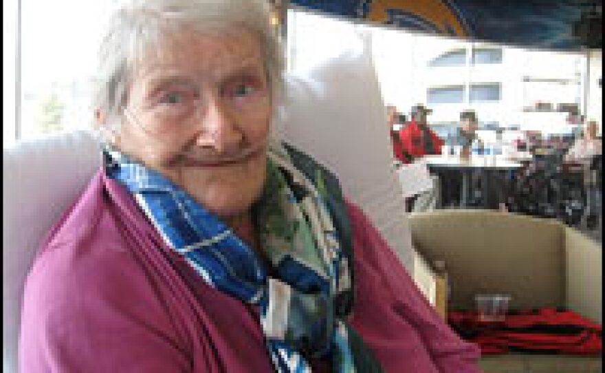 Marianne Bridenbach, 91, waits in Qualcomm Stadium's private luxury bar room where 90 convalescent patients have taken refuge since evacuating Villa Monte Vista Nursing Home on Monday.
