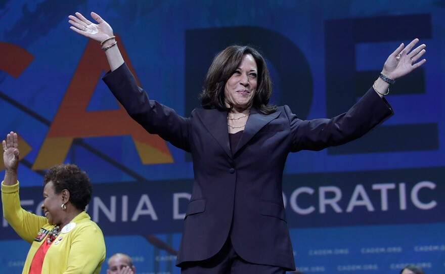 Democratic presidential candidate Sen. Kamala Harris, D-Calif., gestures in front of Congresswoman Barbara Lee before speaking during the 2019 California Democratic Party State Organizing Convention in San Francisco, Saturday, June 1, 2019.