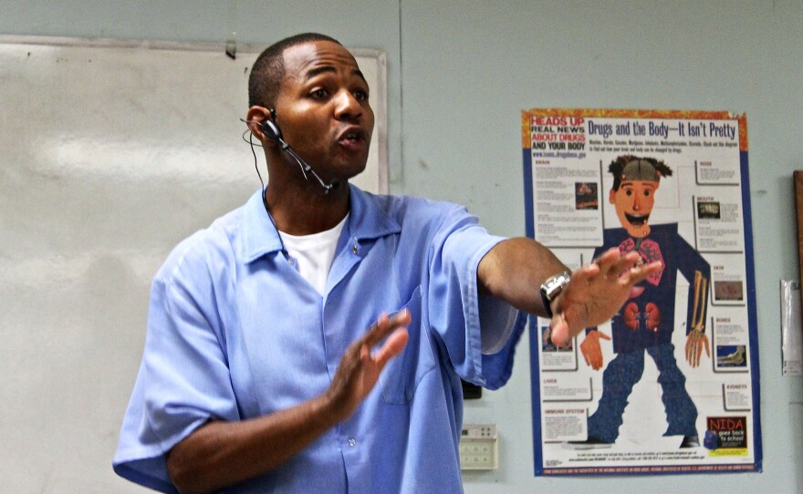 Curtis Carroll — also known as "Wall Street" —  teaches prisoners at San Quentin State Prison about stocks.
