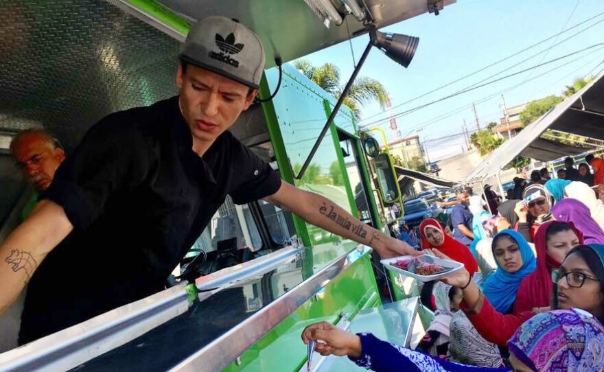 Muslims and Latinos line up for free halal tacos outside a mosque in Rosarito, in Baja California, Mexico, as part of the #TacoTrucksatEveryMosque Crosses the Border event, Sept. 1, 2017. The events seek to foster unity between two communities facing increasing discrimination.