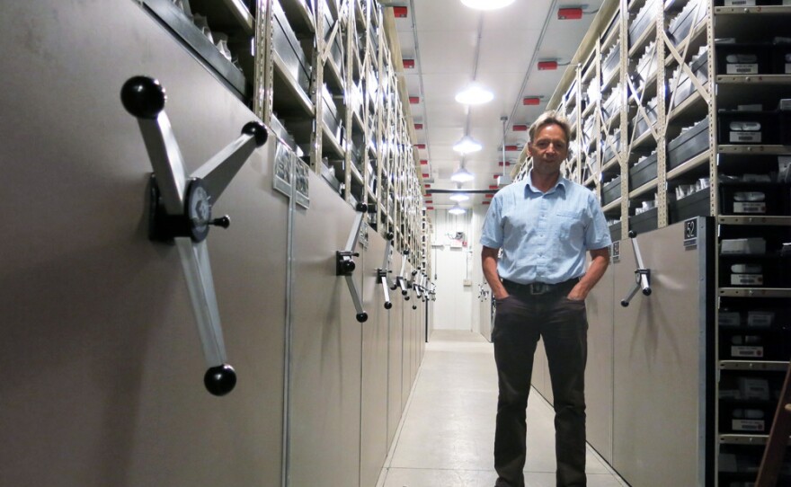 Dave Dierig, research leader at the National Center for Genetic Resources Preservation, stands among the ceiling-high shelves that hold the 600,000 seed packets in this cold storage vault.