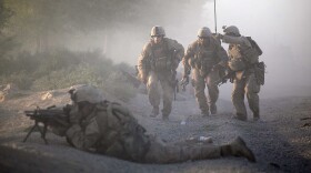 Marines with the 2nd Marine Expeditionary Brigade, RCT 2nd Battalion 8th Marines Echo Co. move into position while they were under enemy fire in Mian Poshteh, Afghanistan.