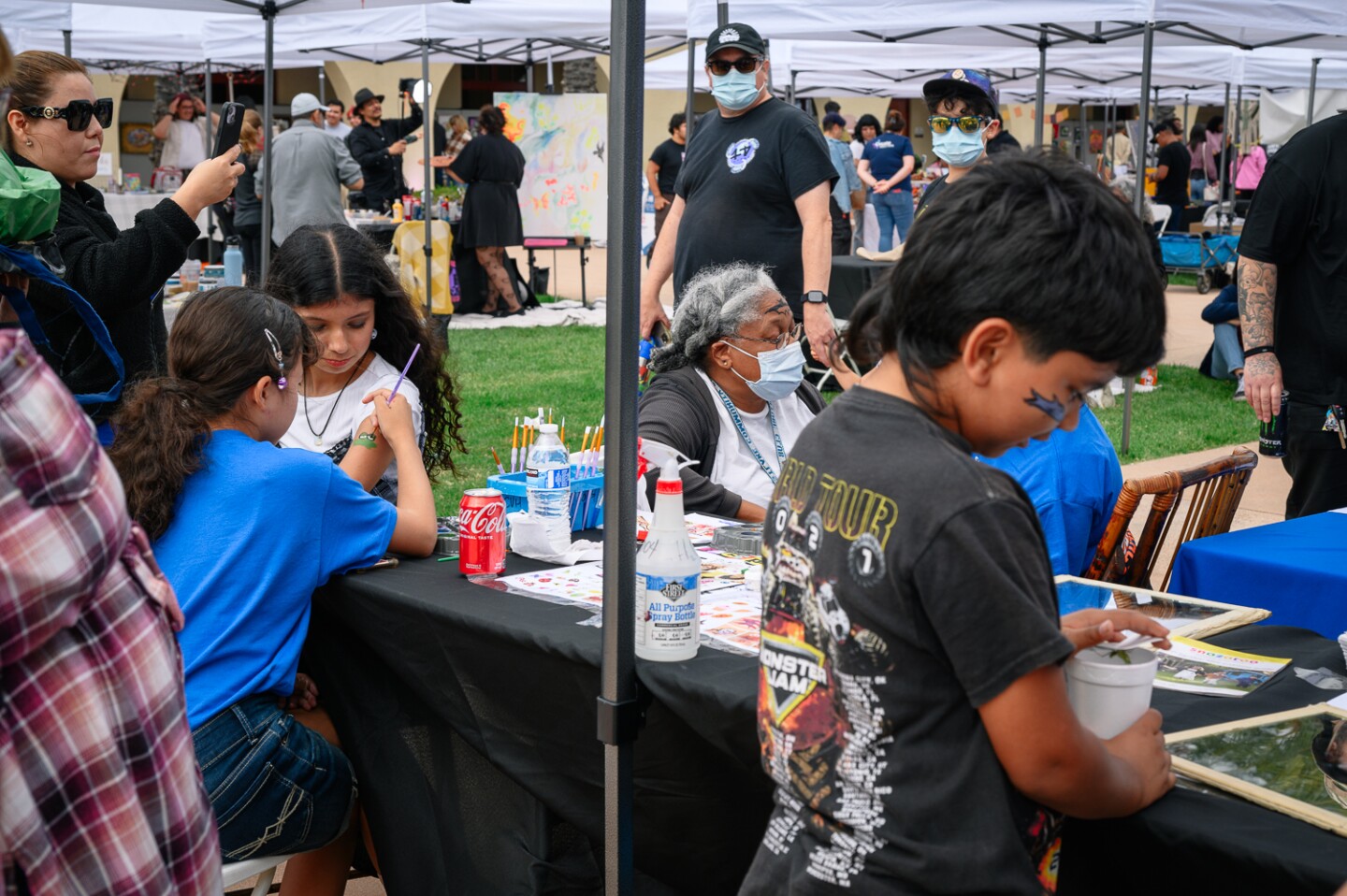 Visitors take part in face and body painting activities at the inaugural Chula Vista Art Fest, outside Chula Vista City Hall, on Sept. 30, 2023.