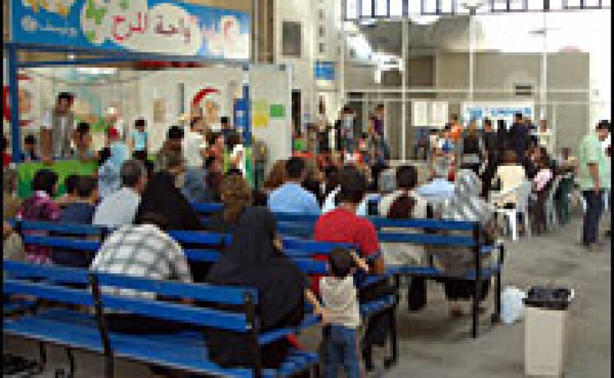 More than 600 people a day are processed at this U.N. refugee center east of Damascus in Syria.